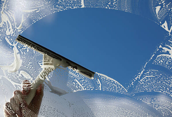 Squeegee cleaning a residential window in Appleton, Wisconsin